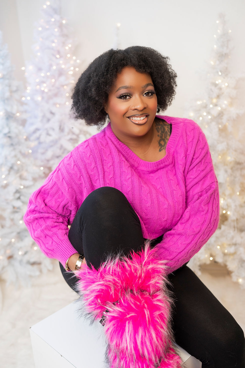 Birthday glam photo shoot with white background and hot pink fur boots and pink sweater by Sage and Soul