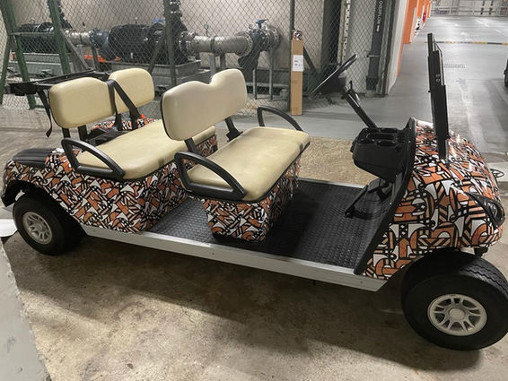 Golf cart with abstract patterned graphics