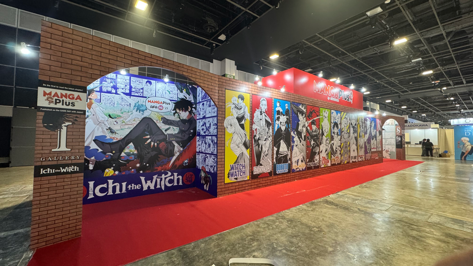 Exhibition booth featuring Manga Plus and Ichi the Witch artwork