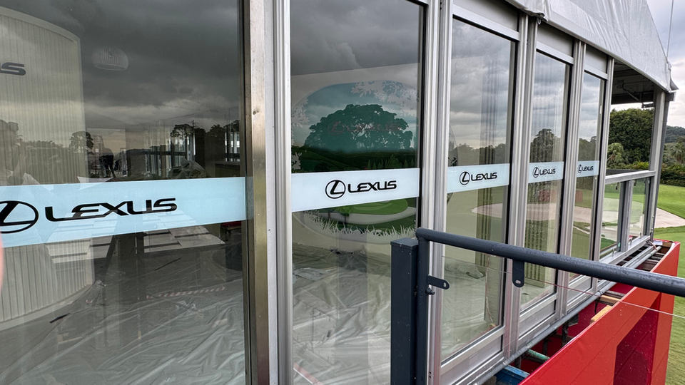 Lexus branding on windows overlooking golf course
