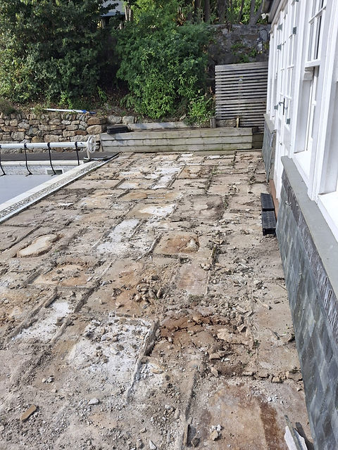 before-poolside-patio-uneven-slabs-cornwall.jpg