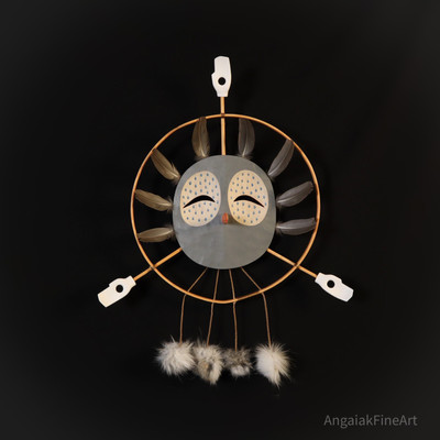 Contemporary Stylized Yup'ik Eskimo Owl Mask. Grey with hoops, feathers, and fur, and appendages.