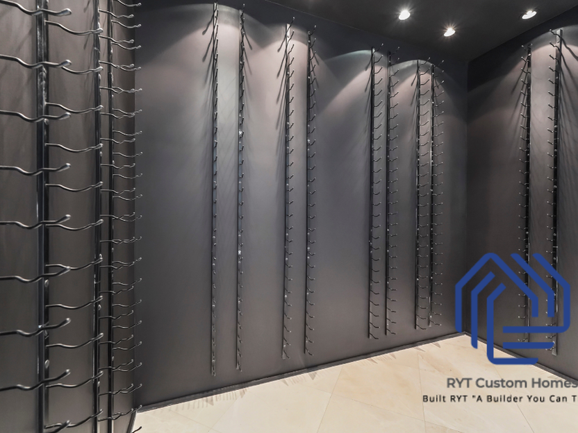 Walk in wine refrigerator.  Floor to ceiling bottle racks. 