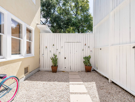 View of the privacy fence and gated entrance to the guest area. 