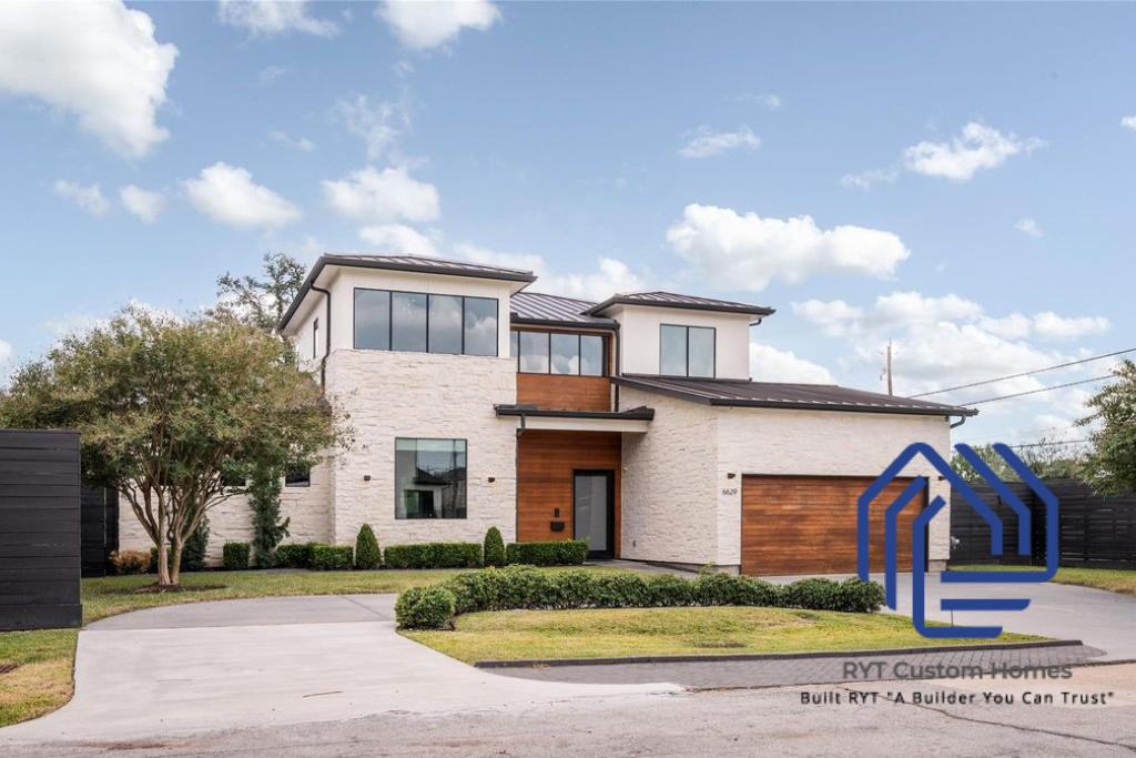 Stunning, two-story, custom home with circle driveway. Large windows, white stone, and warm wooden trim and garage door on the front.