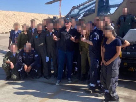 Quentin Tarantino poses for pictures as he visits IDF base in Israel