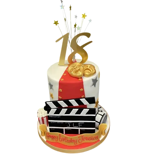 Bespoke cake featuring edible film reels and camera decorations for a celebration in Solihull, West Midlands.