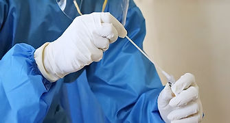 a laboratory worker takes a swab test_ed_edited.jpg