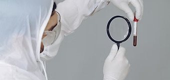 man-protective-suit-glasses-grey-wall_ed