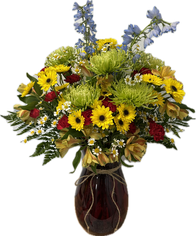 A large arrangement with delphinium, disbuds, and button daisies.