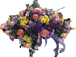 A casket piece with a purple and yellow color scheme, featuring roses and daisies.