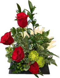 A medium arrangement with roses and disbuds.