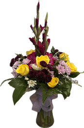 A large arrangement with a purple and yellow color scheme, featuring roses, daisies, and gladiolas.