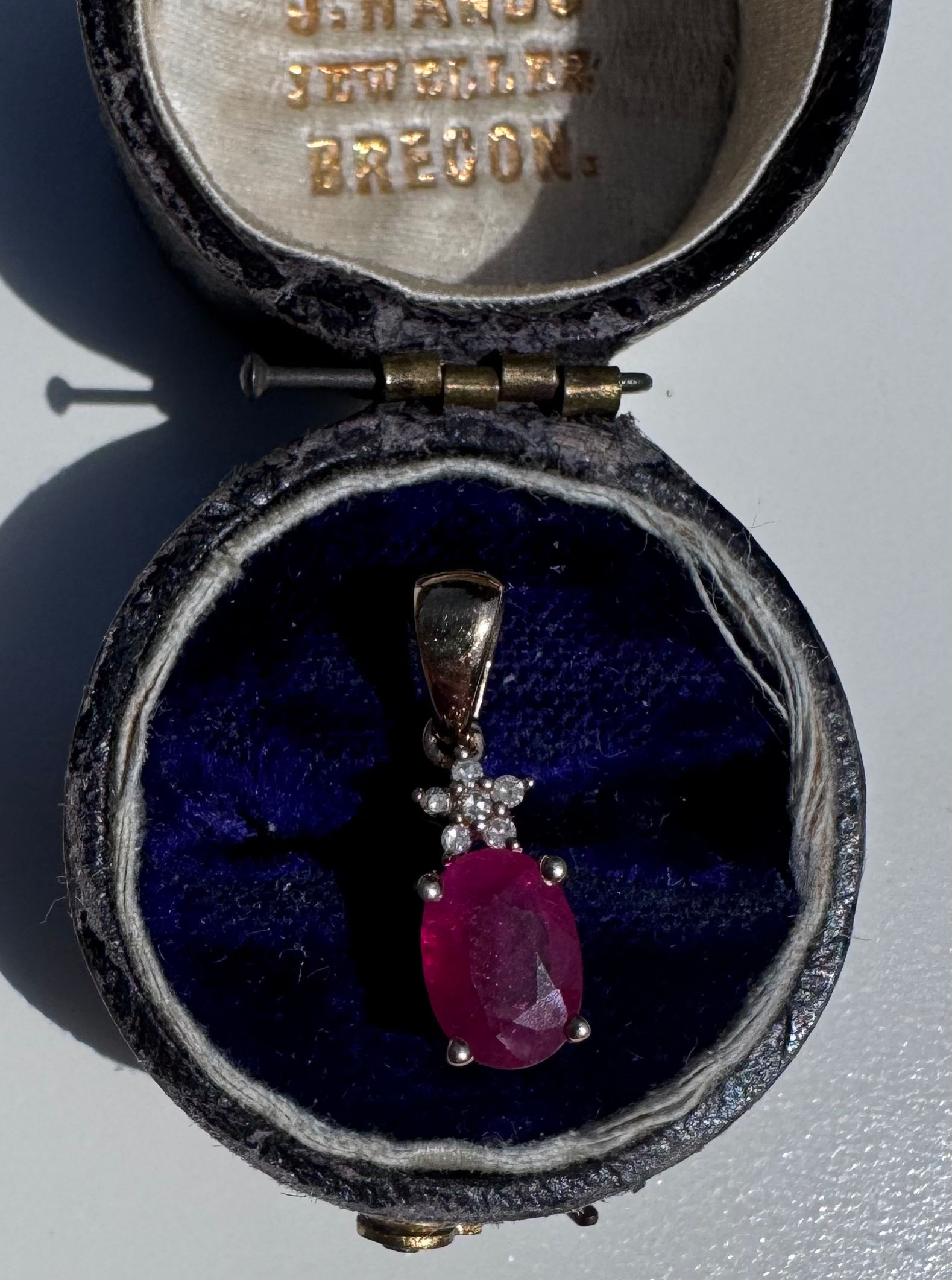 Pink ruby and diamond pendant in 9ct yellow gold