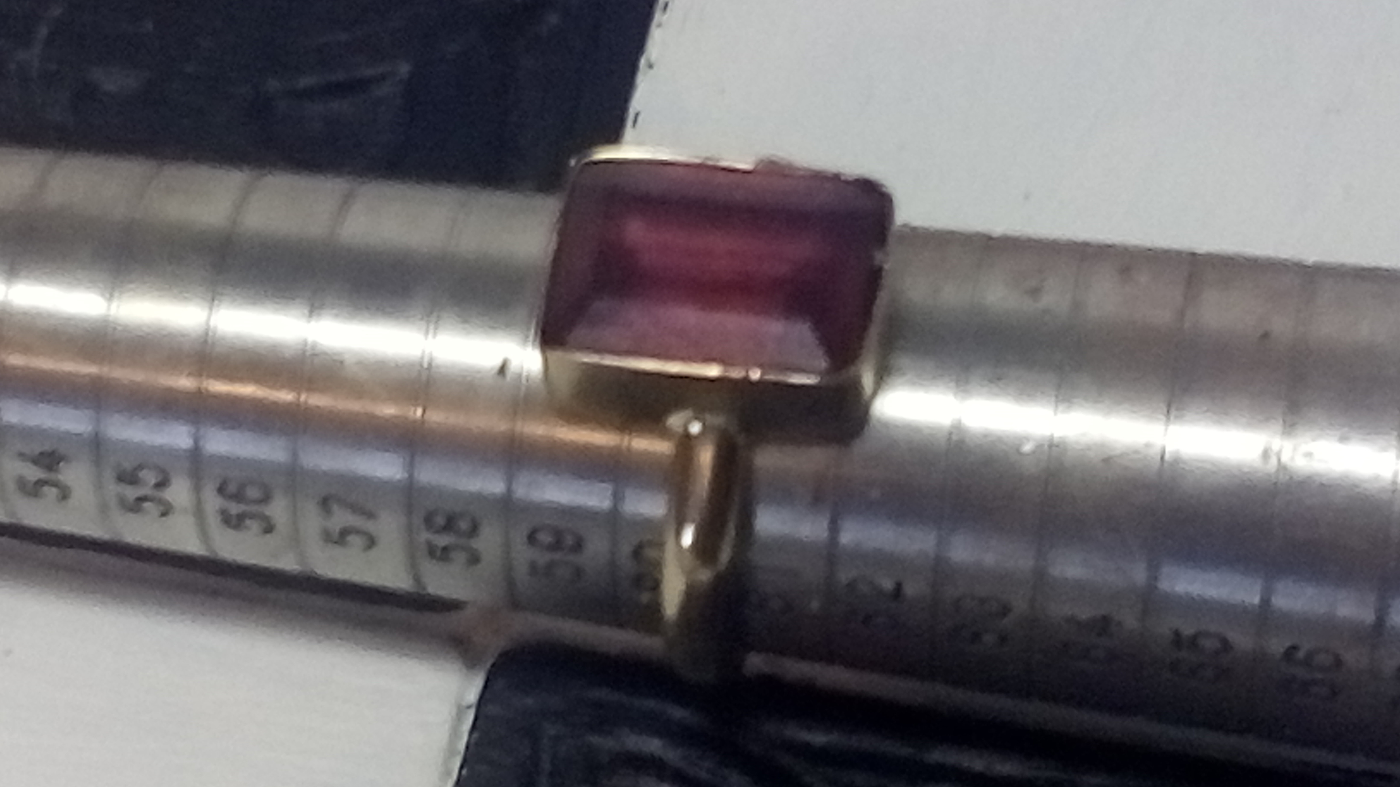7ct octagon cut ruby in 4.1 grams of 9ct yellow gold