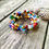 Thumbnail: Memory Wire Wrap Bracelet w Glass Beads + Charms