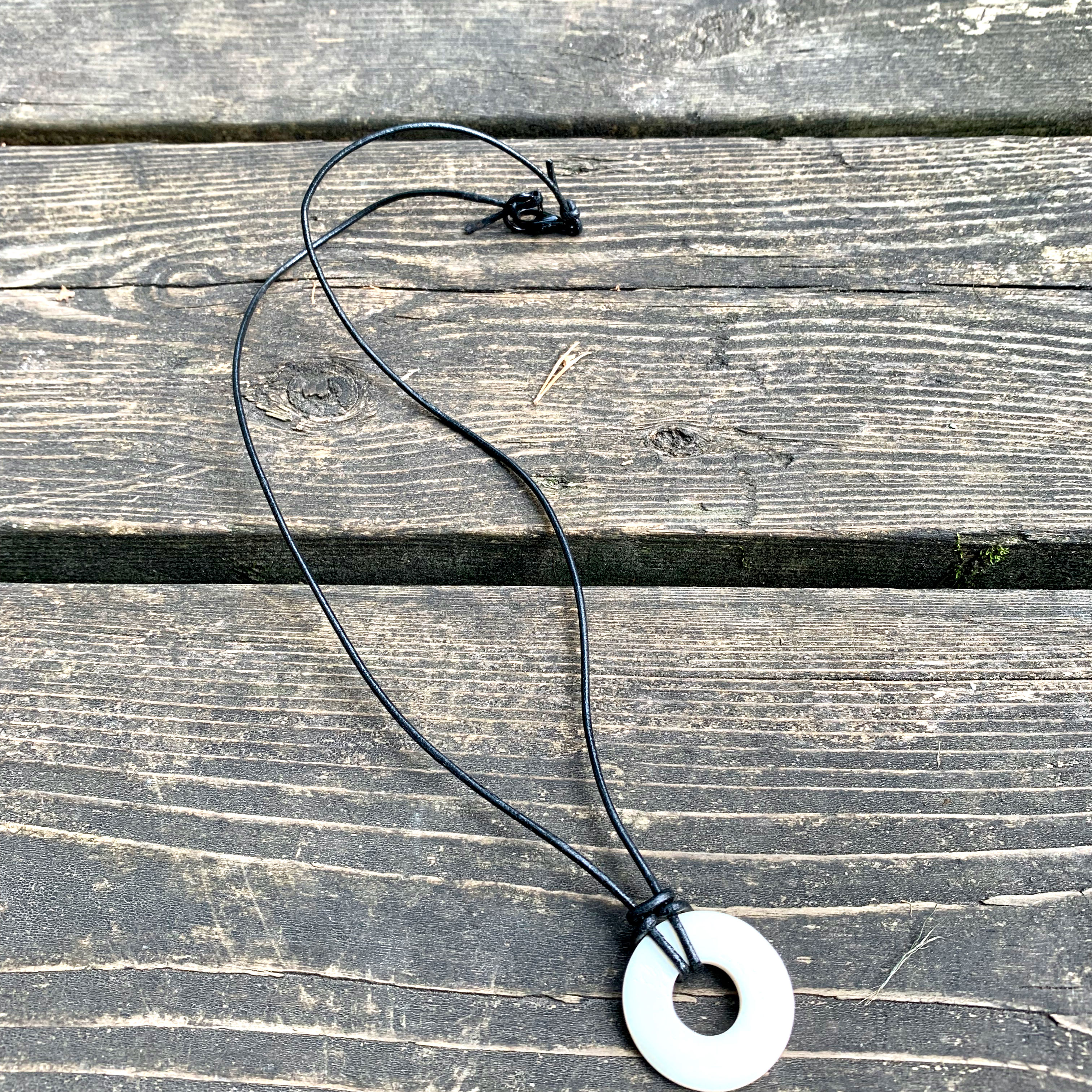 White Carved Bone Circle Pendant Necklace on Black Leather Cord w Black Clasp