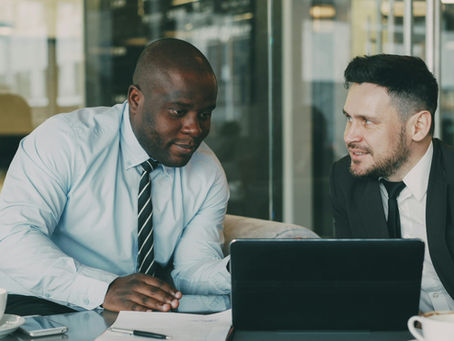 Business owners reviewing documents together at an office table