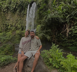 Travelers in front of a waterfall in Lombok Indonesia