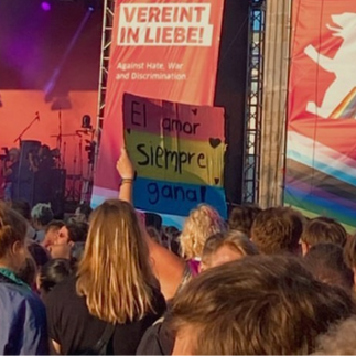 Berlin Pride parade with music floats and large crowd