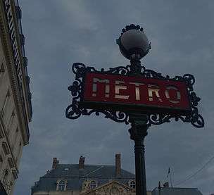 Paris metro entrance with the iconic METRO sign