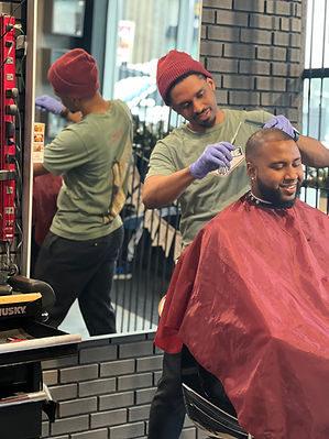 barber trimming hair