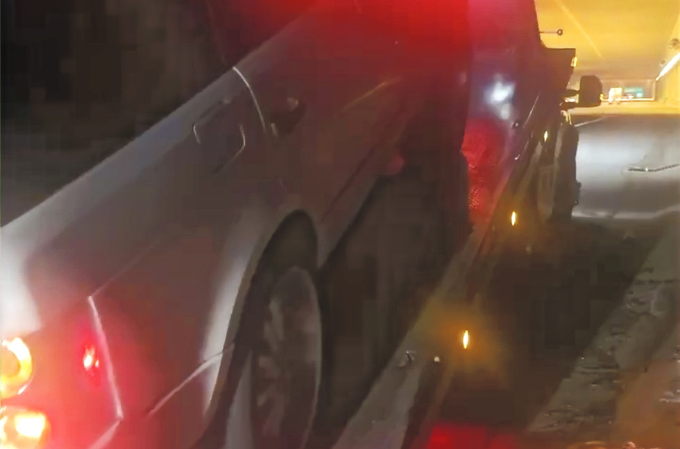 Rapid Towing & Roadside Rescue team assisting a car at night
