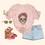 Thumbnail: FOREVER FRIDA graphic tee styled with denim shorts, pink velvet heels, and sunglasses – bold skull shirt for women.