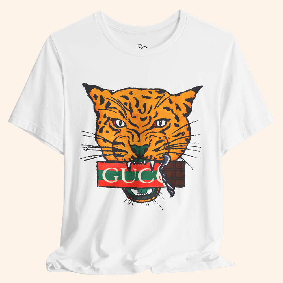 White t-shirt with bold tiger graphic and chocolate bar detail, trendy street-style fashion tee on neutral background.