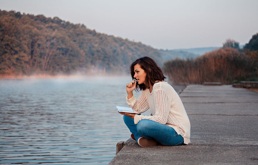 Woman journals by lake - iStock-638555204.jpg