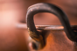 copper-pans-with-handle-on-the-blurred-background-2023-11-27-04-58-56-utc.JPG