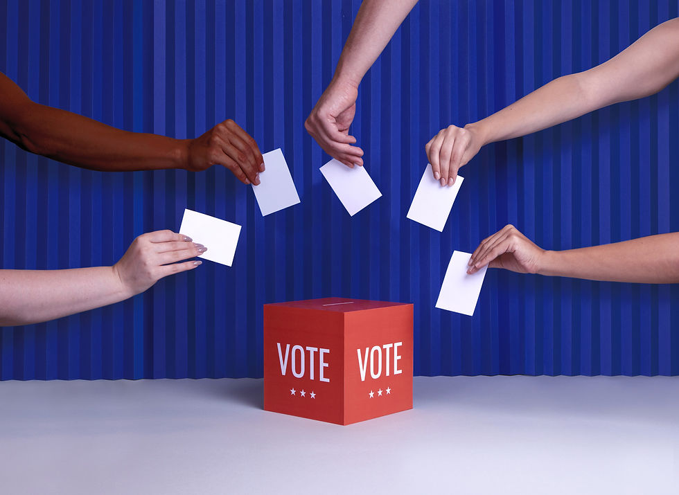 Voting box display with five separate hands placing ballots in the voting box.