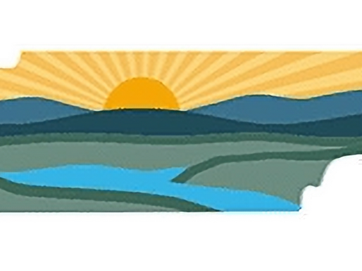 TennGreen's logo depicting a landscape of mountains, sun with rays, and a river