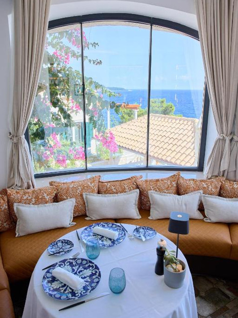 A table set for dining with a view of the ocean at Villa Orabelle, a boutique hotel in Dubrovnik.