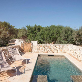 Pool and two chairs at luxury hotel menorca experimental in Menorca