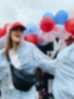 girl dancing with baloons