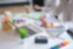 Interior designers in Singapore selecting colour palettes and affordable interior design materials for home renovation projects.