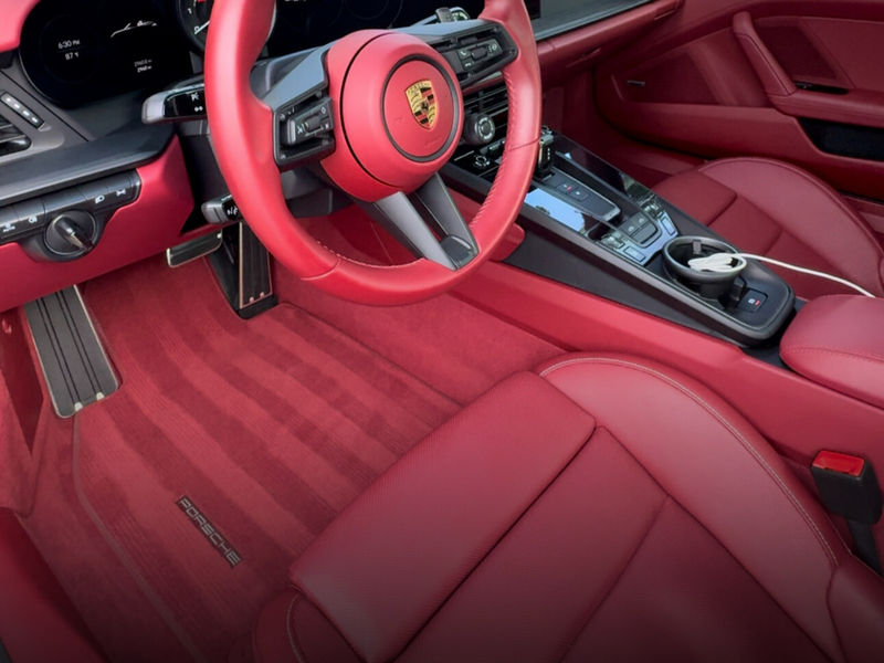 Red leather Porsche interior after a full detail