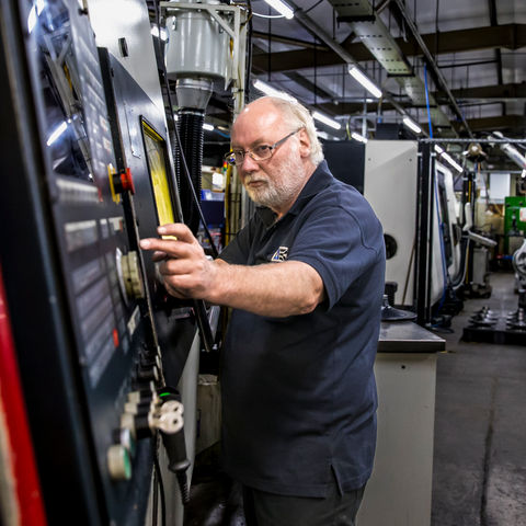 factory worker operating machinery