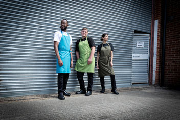 modelling work aprons outside warehouse factory Sheffield
