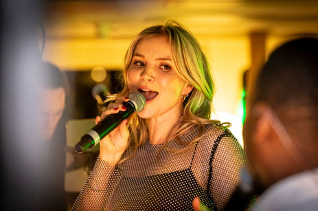 blonde singer with microphone