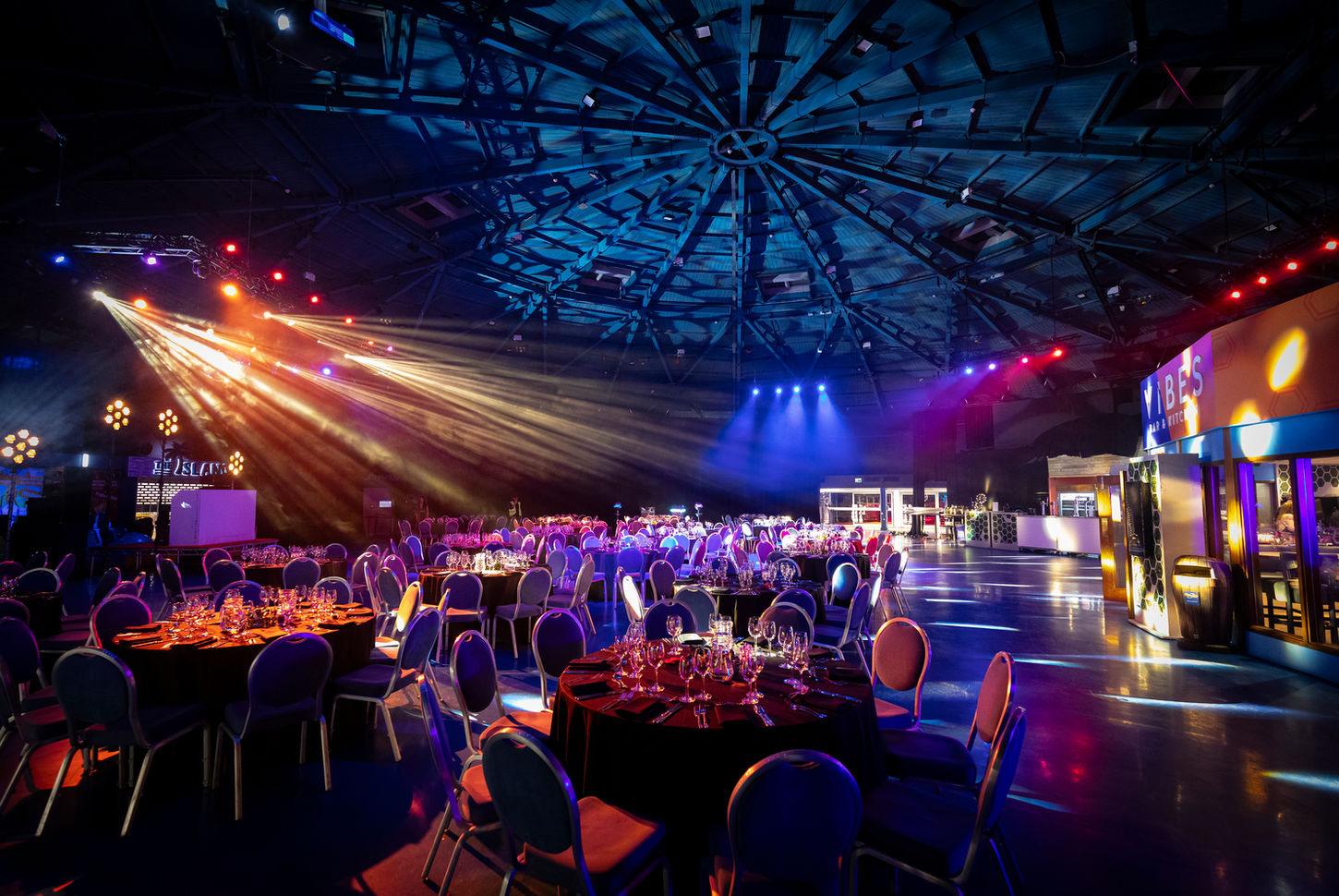 spot lights on round table black tie Christmas event