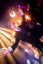 man in suit and cap dancing on the dance floor