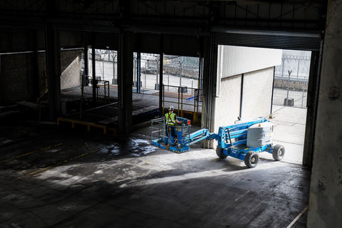 cherry picker in a empty industrial unit