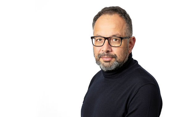 Executive headshot London, professional man with beard and glasses