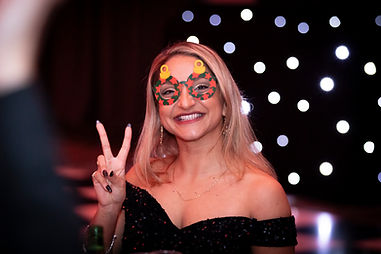 Woman smiling with Christmas Glasses