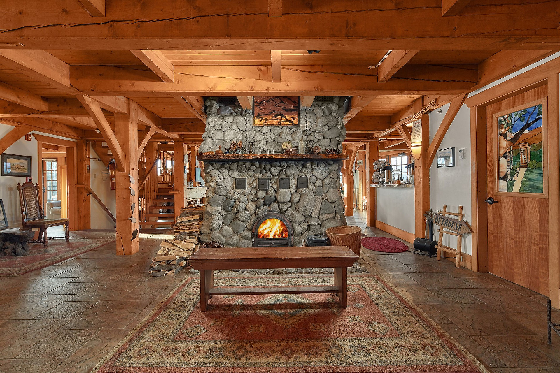 A living room with a stone fireplace