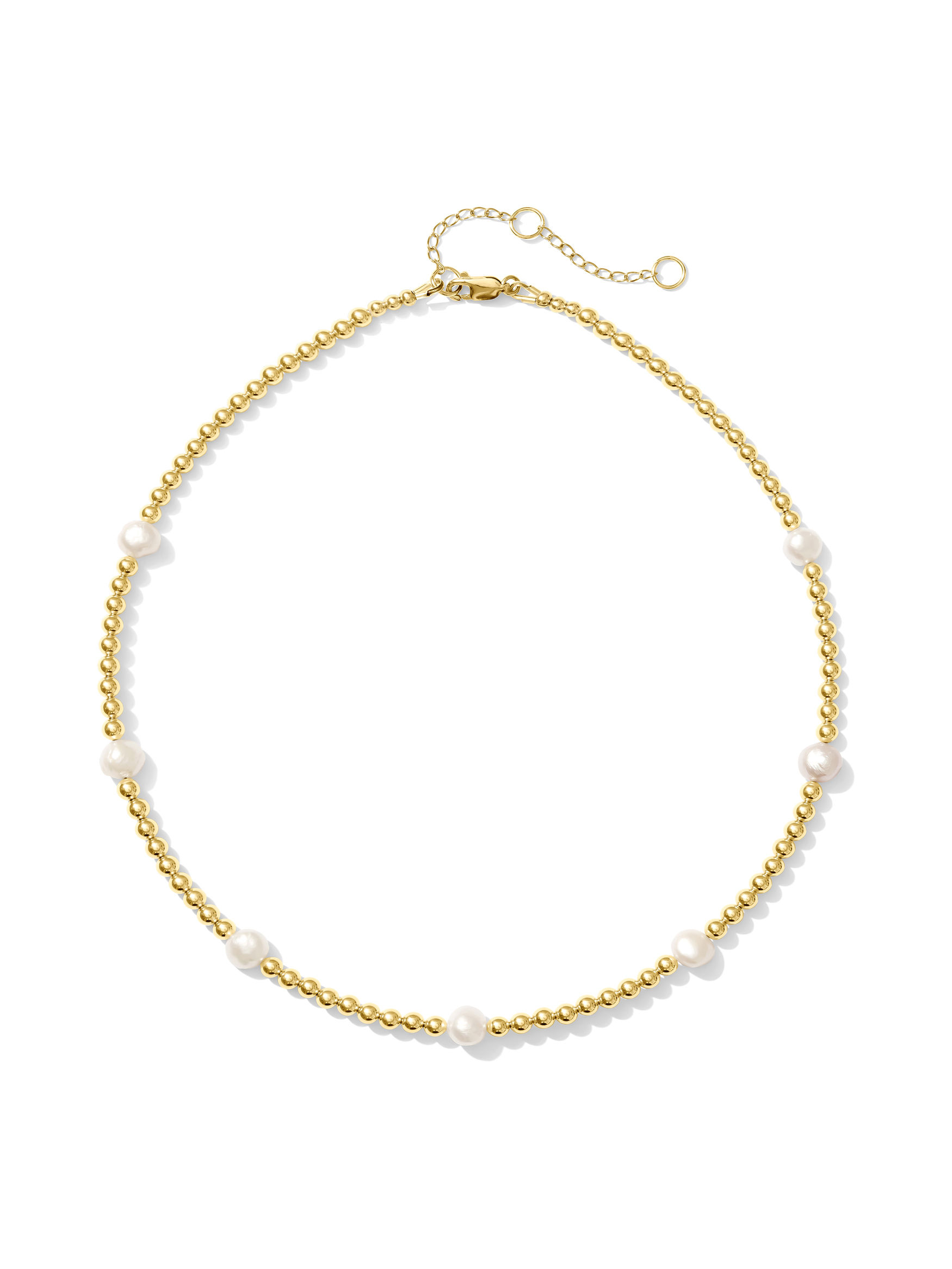 gold and pearl necklace on white background