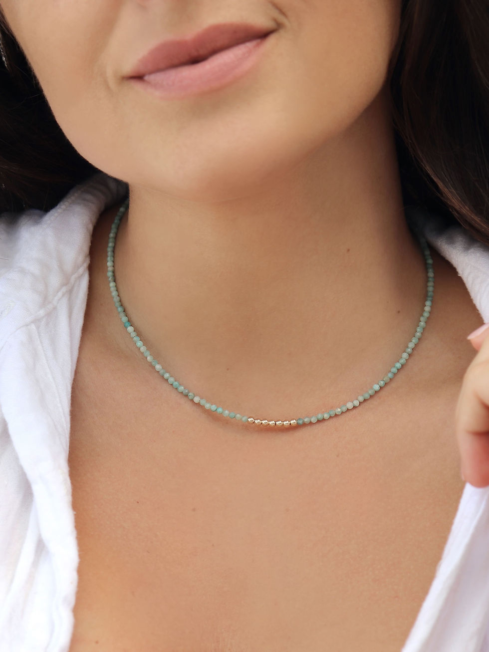 green gemstone necklace on a model