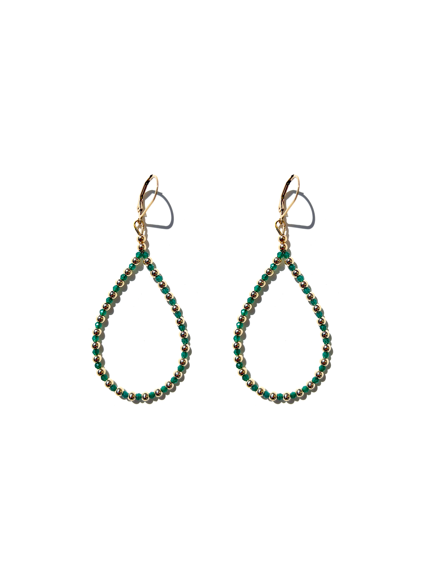 green gemstone teardrop earrings on white